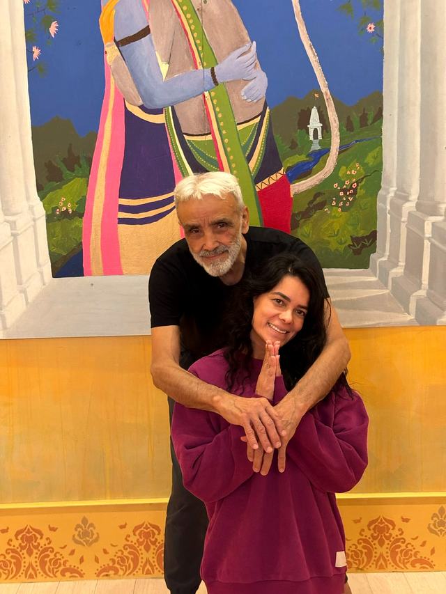 Pamela smiling with her teacher