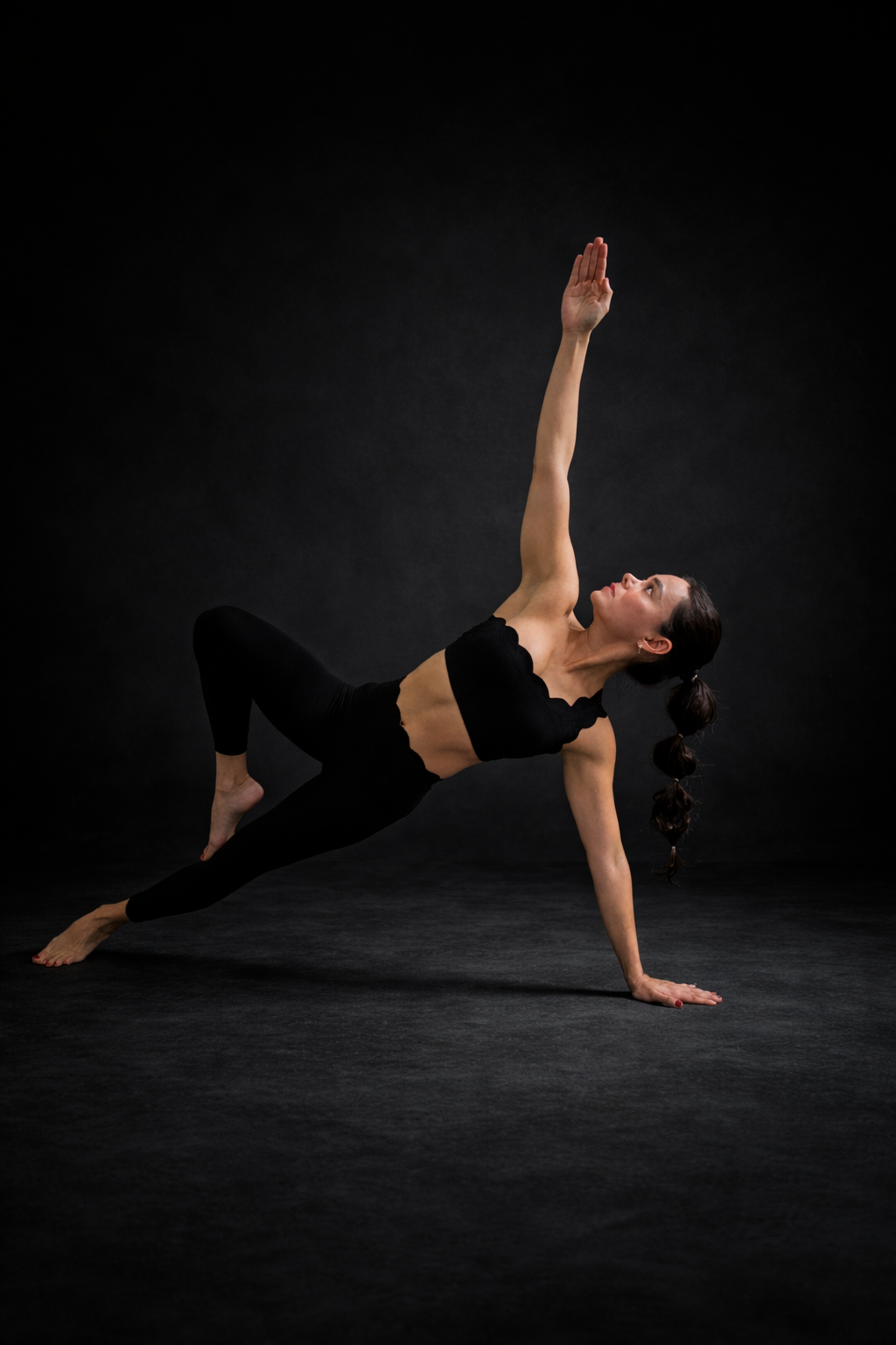 Pamela holding a strong yoga pose